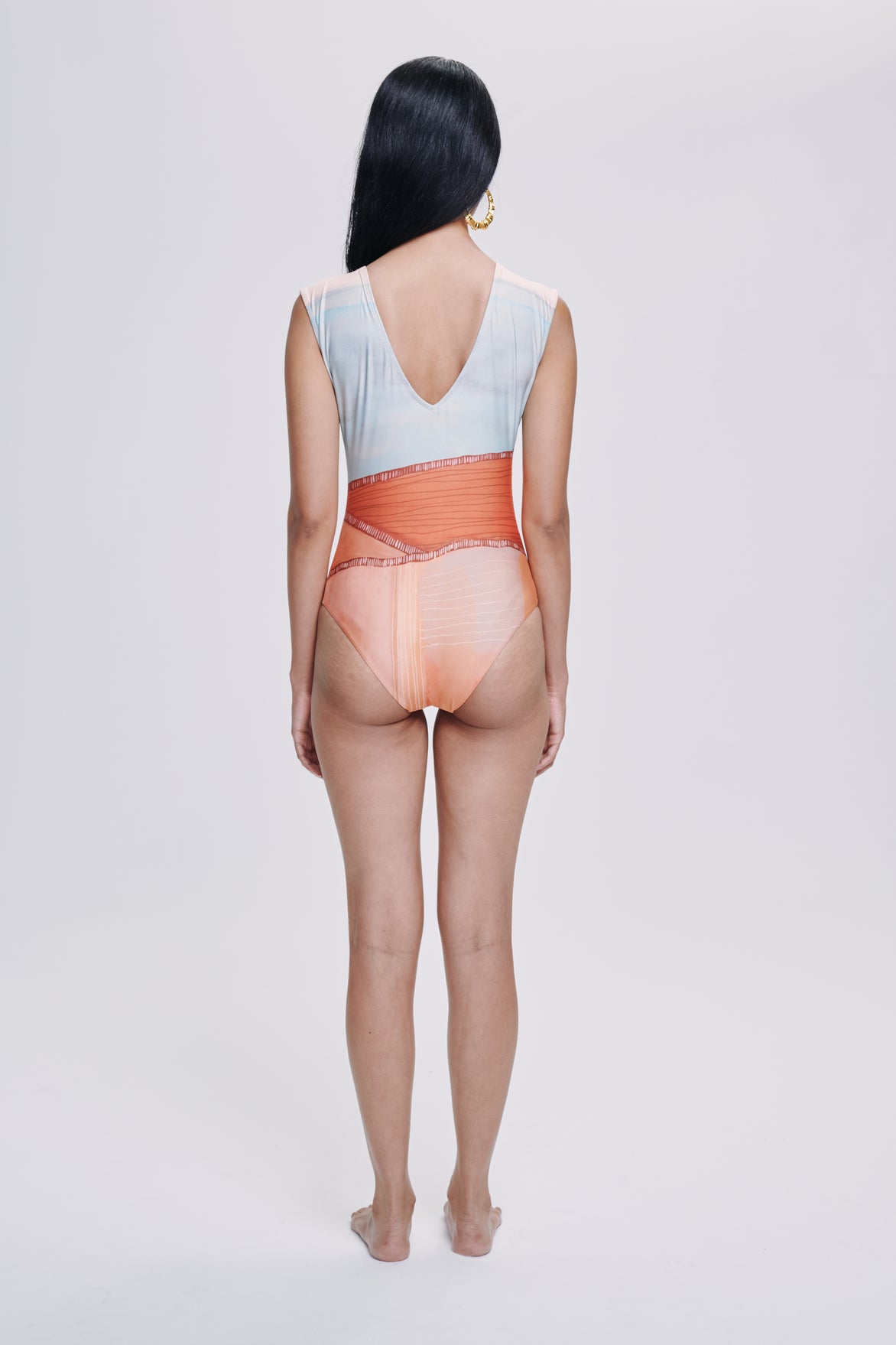 Carolina K Liset One Piece clothing in vibrant fabric, shown on a model with a stylish, modern design and fitted silhouette.