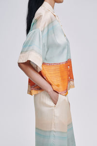 Carolina K kimono top featuring flowy fabric and wide sleeves, styled as a casual yet elegant clothing piece.