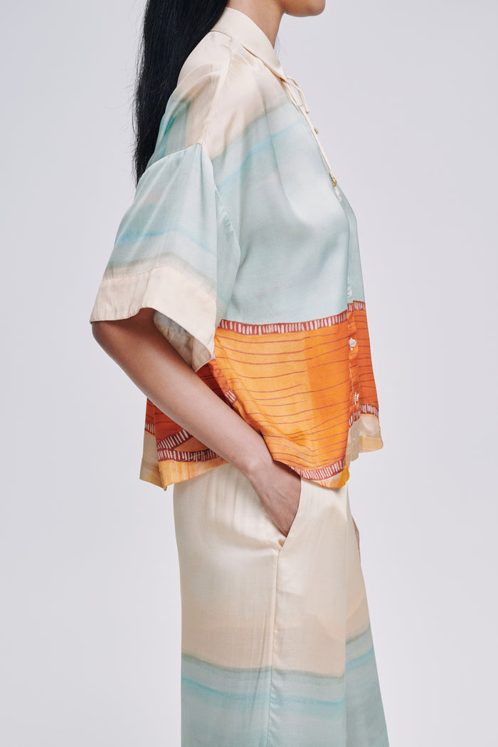 Carolina K kimono top featuring flowy fabric and wide sleeves, styled as a casual yet elegant clothing piece.