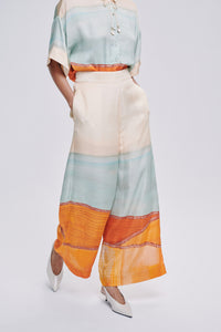 Carolina K Palazzo pants in flowing fabric, featuring wide-leg design and stylish pattern, perfect for a chic, comfortable look.