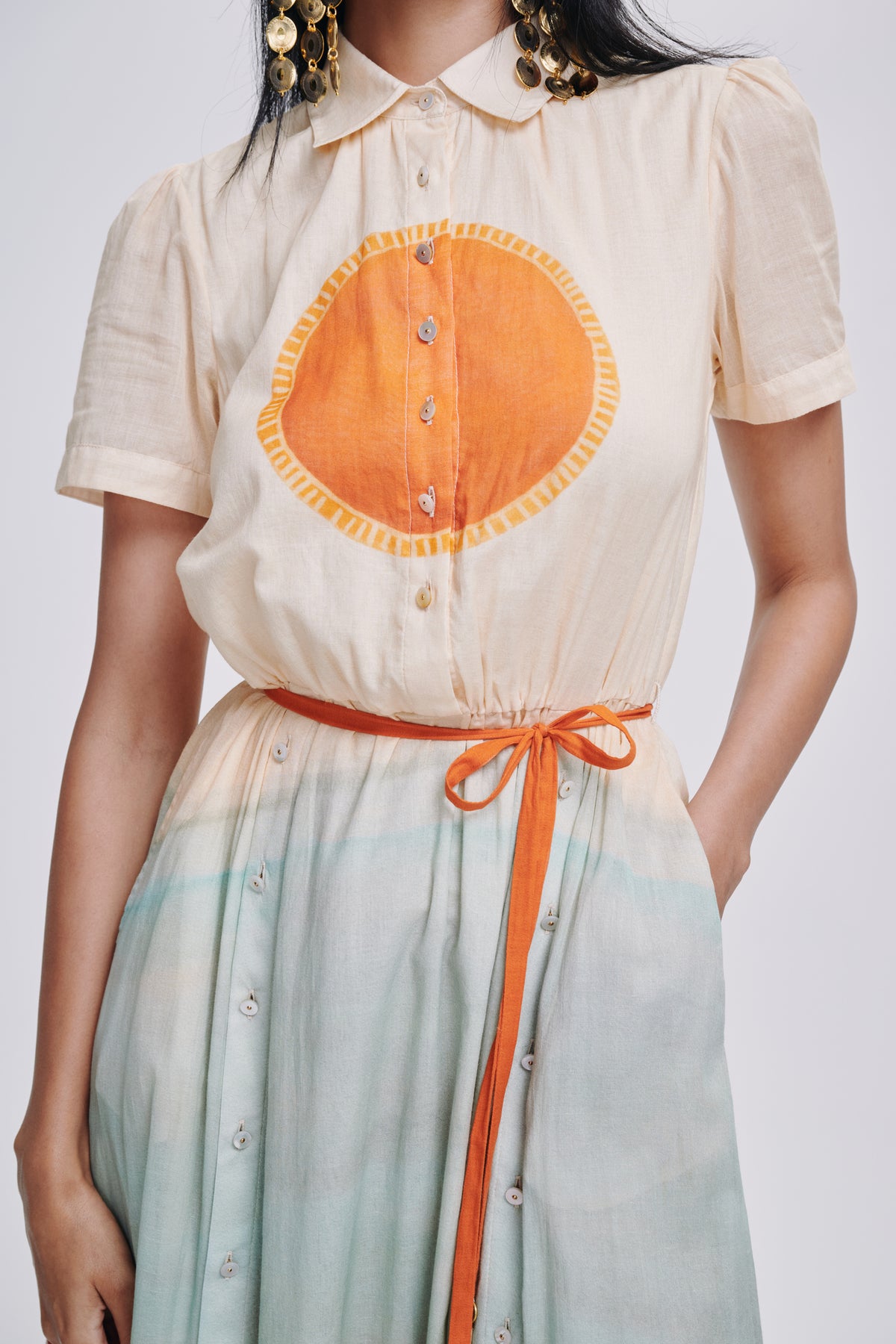 Carolina K Elisetta dress in vibrant fabric, featuring a flowing silhouette and intricate pattern, perfect for stylish occasions.