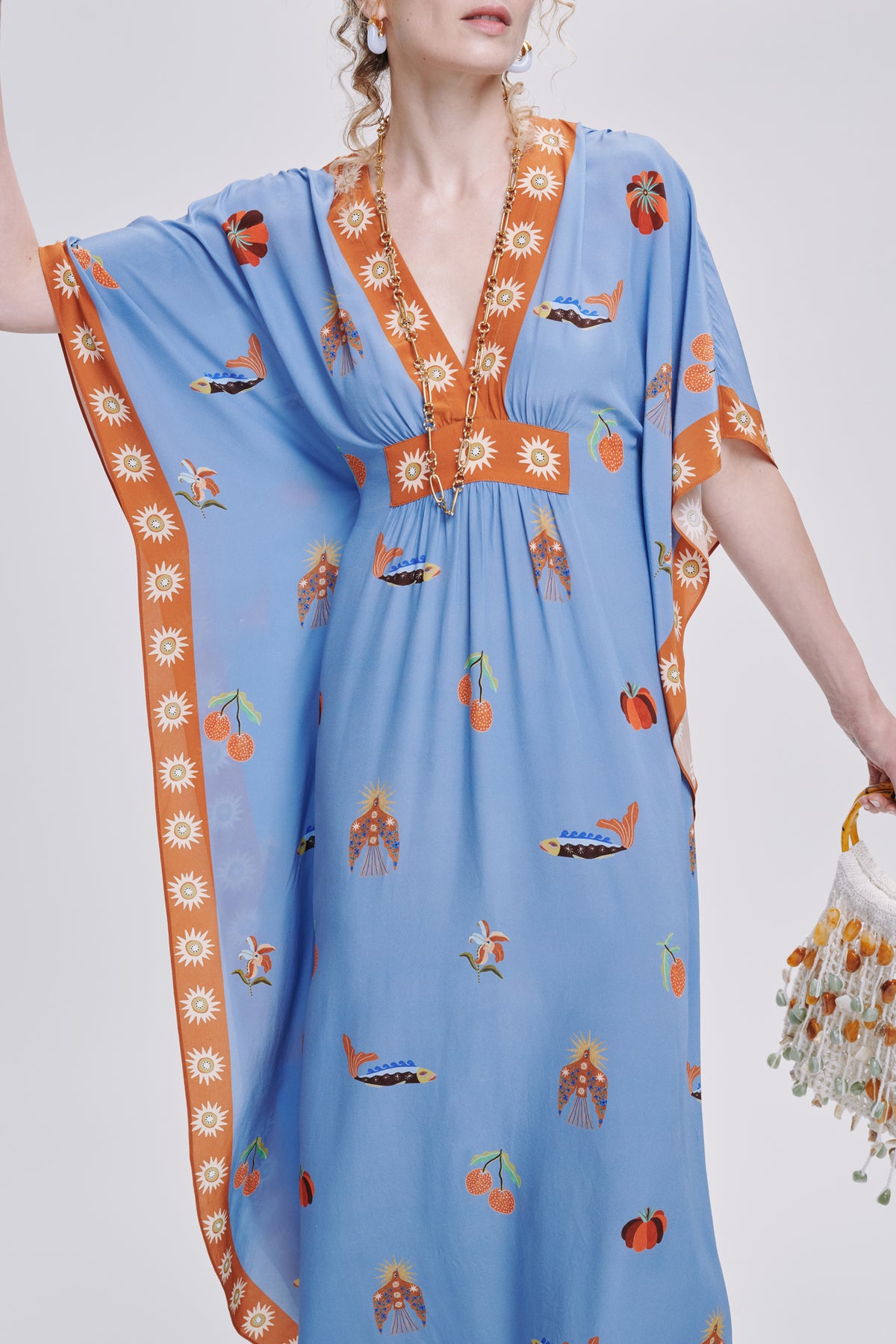 Carolina K Taiel kaftan with intricate patterns and flowing fabric, perfect for elegant, comfortable summer wear.