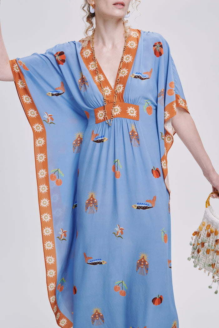 Carolina K Taiel kaftan with intricate patterns and flowing fabric, perfect for elegant, comfortable summer wear.