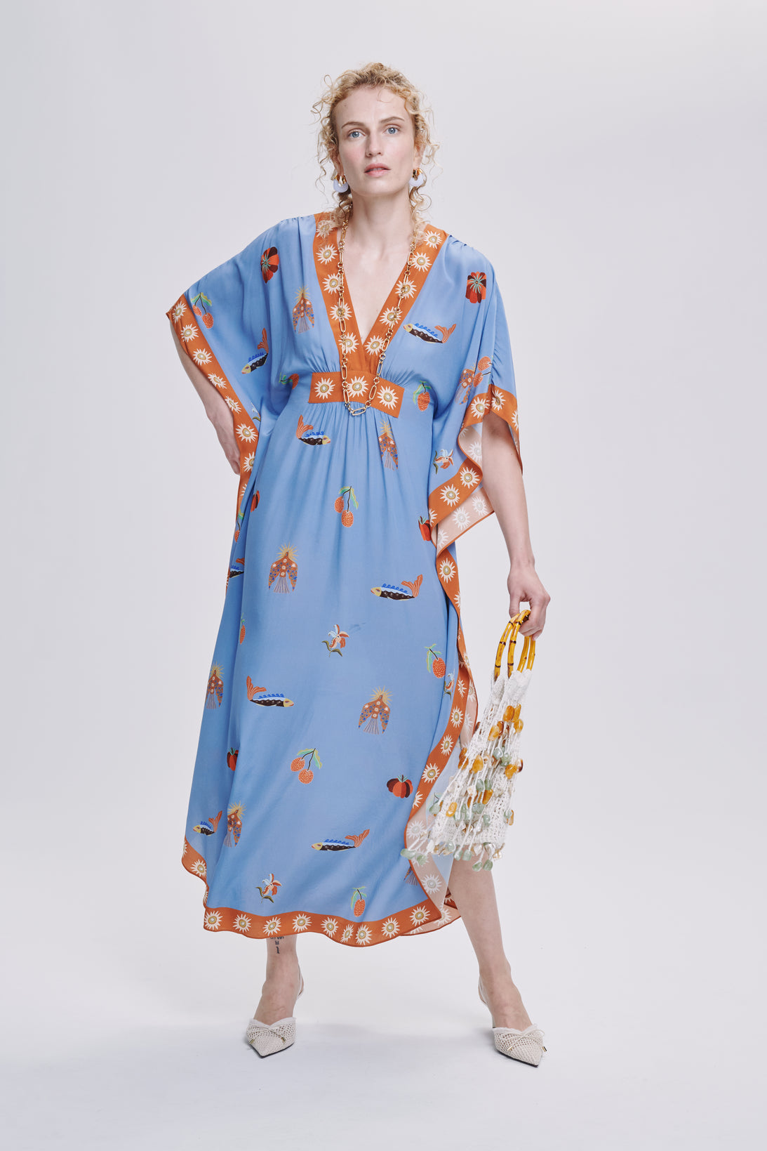 Carolina K Taiel kaftan in vibrant fabric, flowing bohemian clothing with intricate patterns and relaxed fit.
