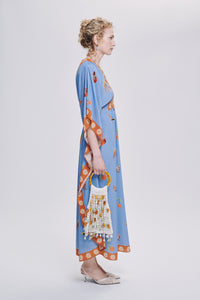 Carolina K Taiel kaftan in vibrant fabric, flowing design, worn as stylish clothing, showcasing intricate patterns and elegant drape.