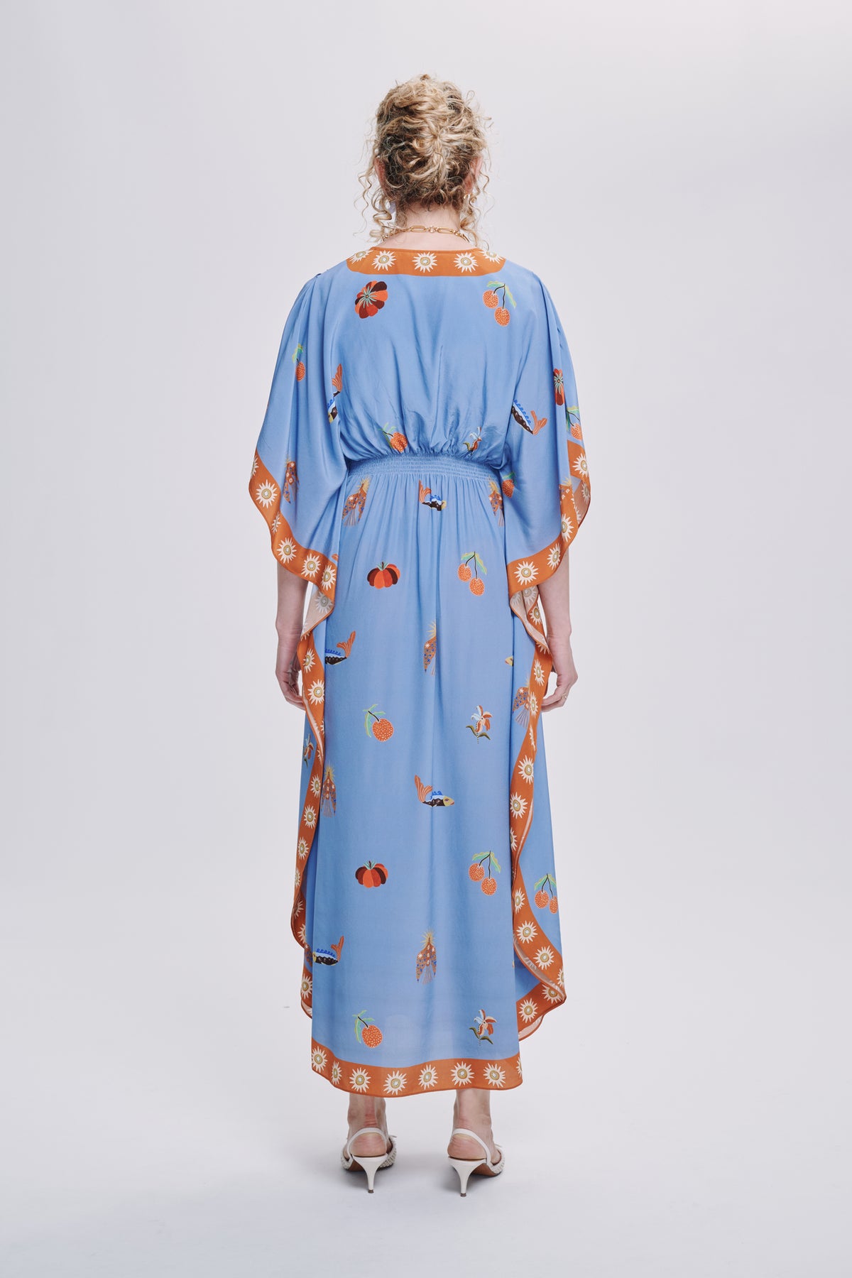 Carolina K Taiel kaftan in vibrant fabric, flowing and elegant, styled as a casual yet chic clothing piece.