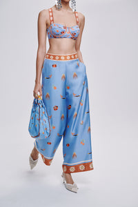 Carolina K Palazzo Pants in flowy fabric with wide-leg design, featuring vibrant patterns and a relaxed fit for stylish comfort.