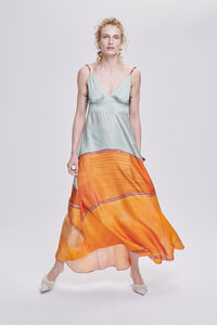 Carolina K star dress, stylish clothing with star pattern, displayed on a hanger against a neutral background.
