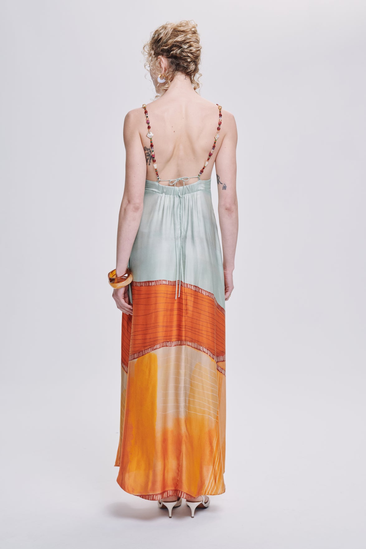 Carolina K star dress, stylish clothing with star patterns, featuring a flowing silhouette and vibrant design.