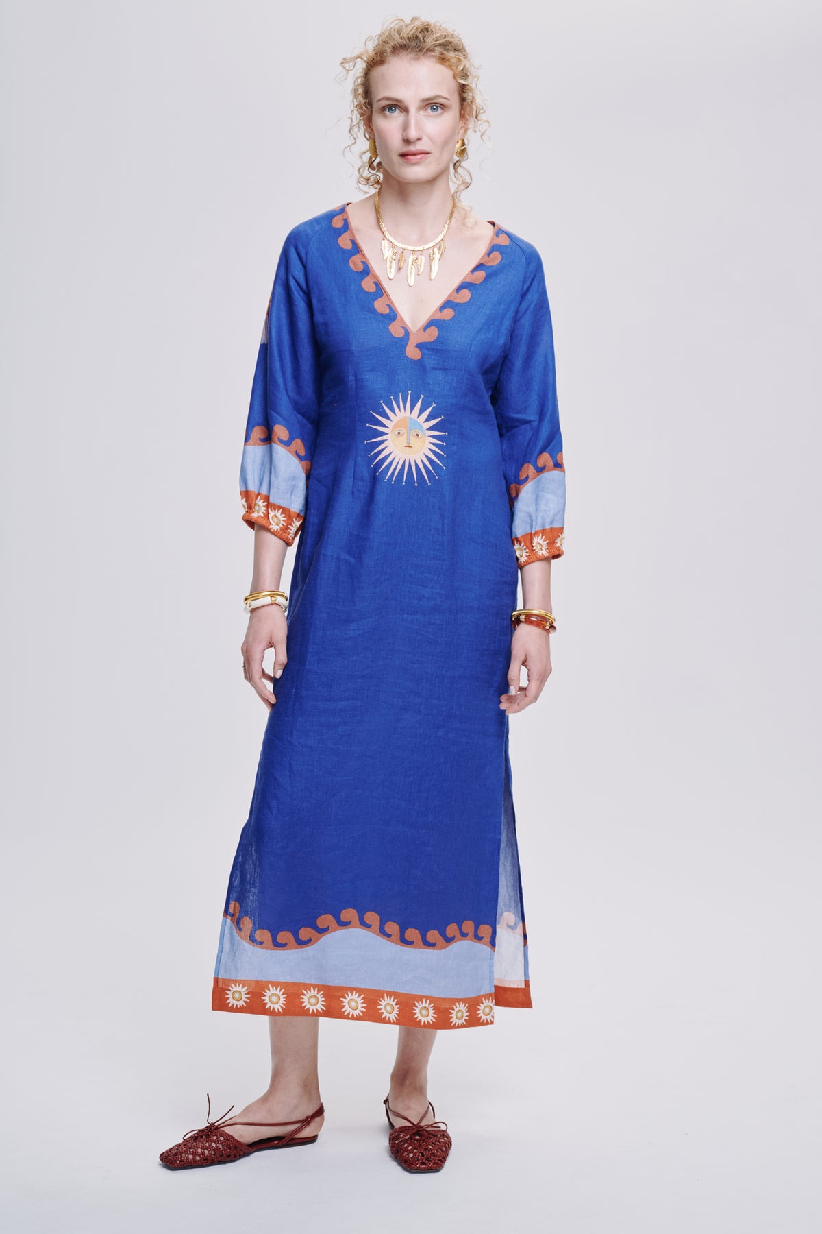 Carolina K Solan dress displayed on a hanger, showcasing its stylish design and vibrant fabric for women’s clothing.
