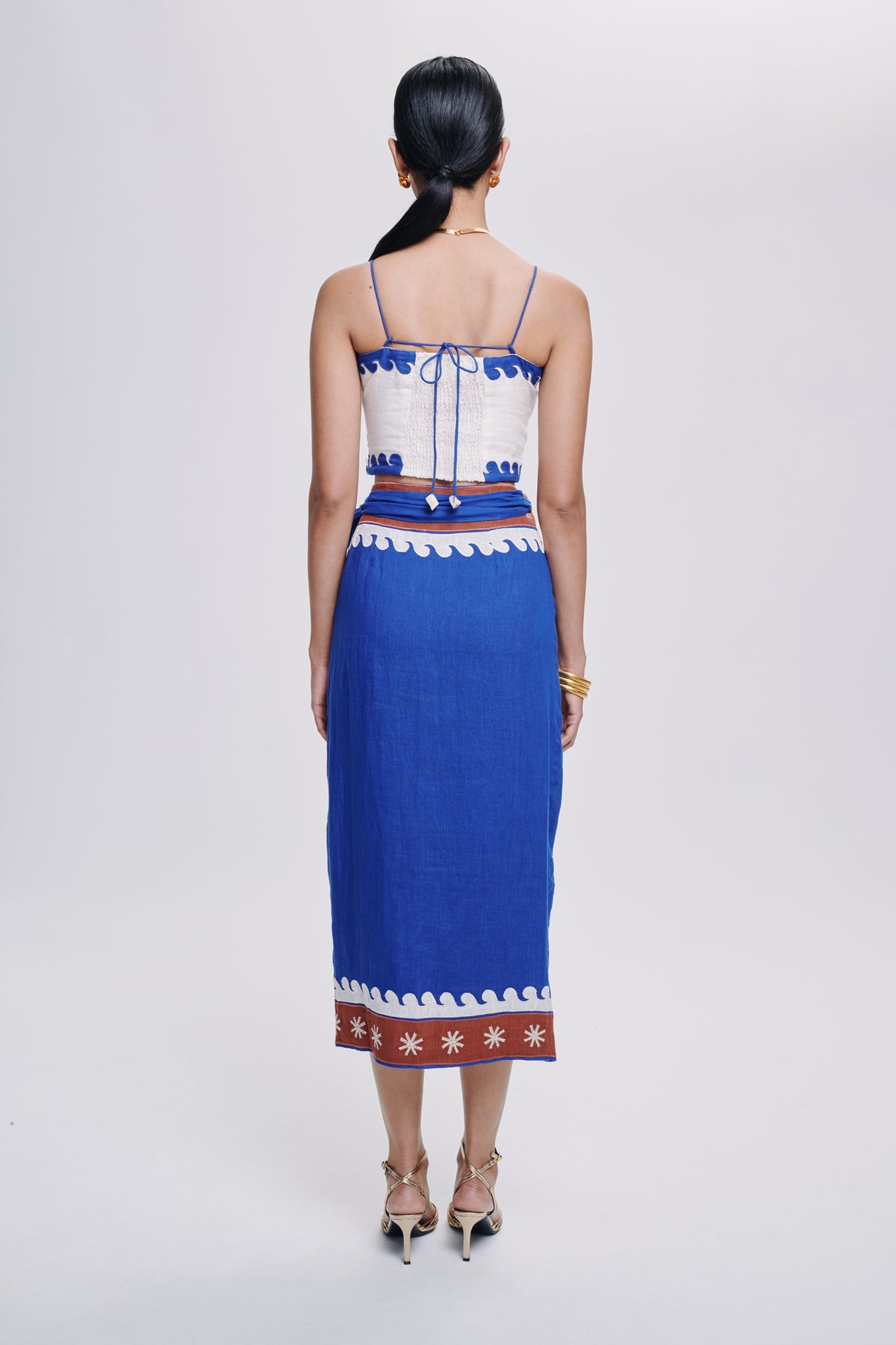 Carolina K Maggie top, stylish women's clothing in a vibrant design, displayed on a model with a focus on the top's fabric and fit.
