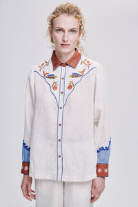Carolina K rodeo shirt in vibrant fabric, featuring Western-style design and detailed stitching, worn by a model.