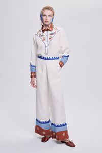 Carolina K palazzo pants in flowing fabric with wide legs and high waist, displayed in a stylish clothing photo.