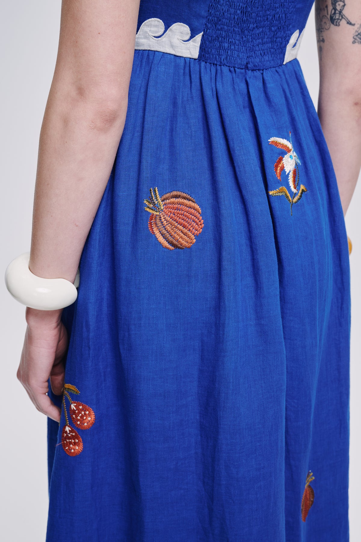 Carolina K Allegra dress in vibrant fabric, featuring a flowing silhouette and intricate details, perfect for stylish occasions.