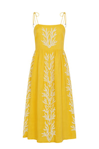 Yellow linen midi dress with a square neckline, adjustable shoulder ties, and white embroidered botanical details throughout. Finished with a relaxed, feminine silhouette.