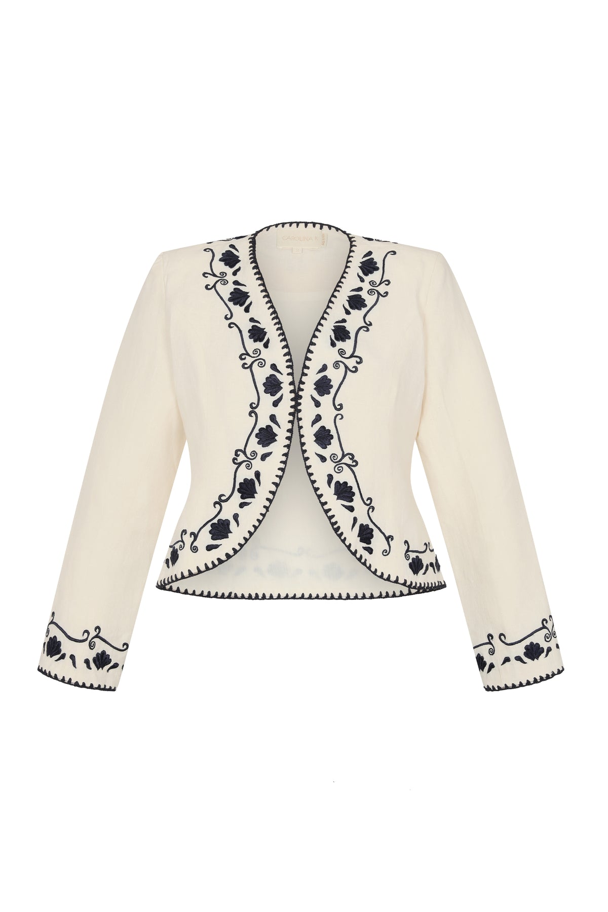 Front view of a cream open-front jacket with navy floral embroidery along the neckline, front edges, cuffs, and hem.