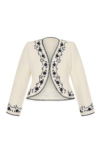 Front view of a cream open-front jacket with navy floral embroidery along the neckline, front edges, cuffs, and hem.