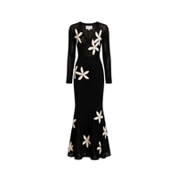 Carolina K Betania Dress featuring vibrant floral patterns and a flowing silhouette, perfect for casual or summer wear.