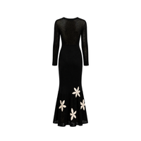Back view of the Carolina K Betania Dress, featuring flowing fabric and intricate detailing for a stylish, elegant look.
