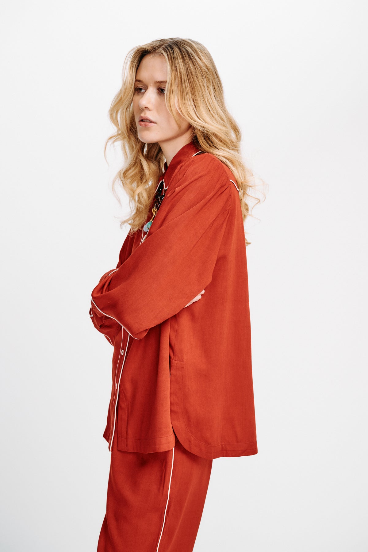 Carolina K rodeo shirt with vibrant print, button front and long sleeves, styled on a model for a fashionable western look.