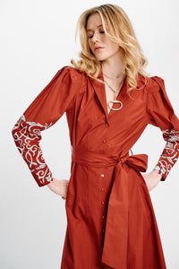 Carolina K Anais Dress shown in a stylish, flowing design with vibrant patterns, perfect for elegant occasions.