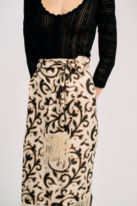 Carolina K Fauna Wrap Skirt in vibrant print, flowing fabric, shown on a model styled for casual or boho chic wear.