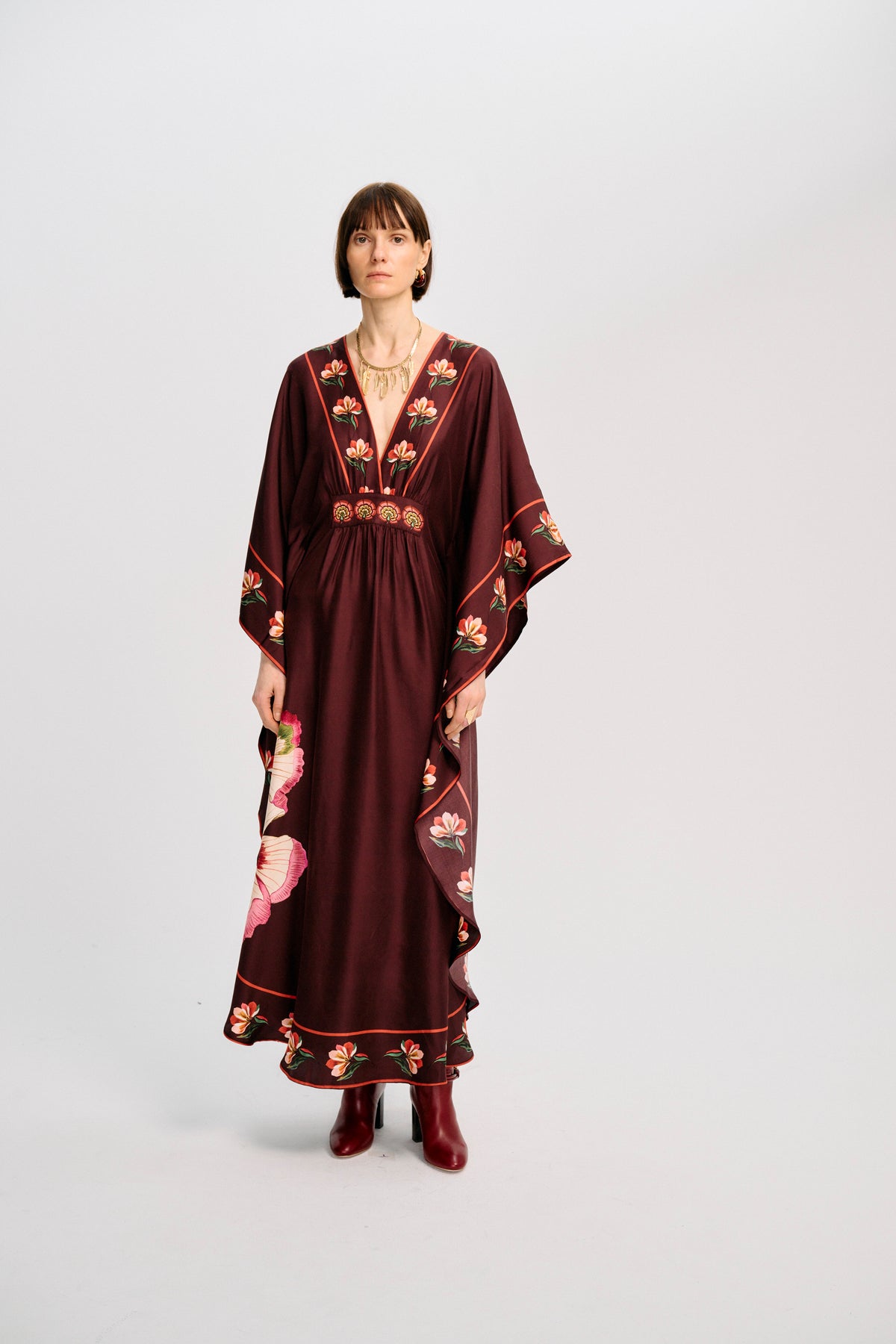 Carolina K Taiel Kaftan in vibrant fabric, flowing style with intricate patterns, showcased on a model.