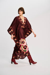 Carolina K Taiel kaftan in vibrant fabric, featuring flowing design and intricate patterns, perfect for elegant summer wear.