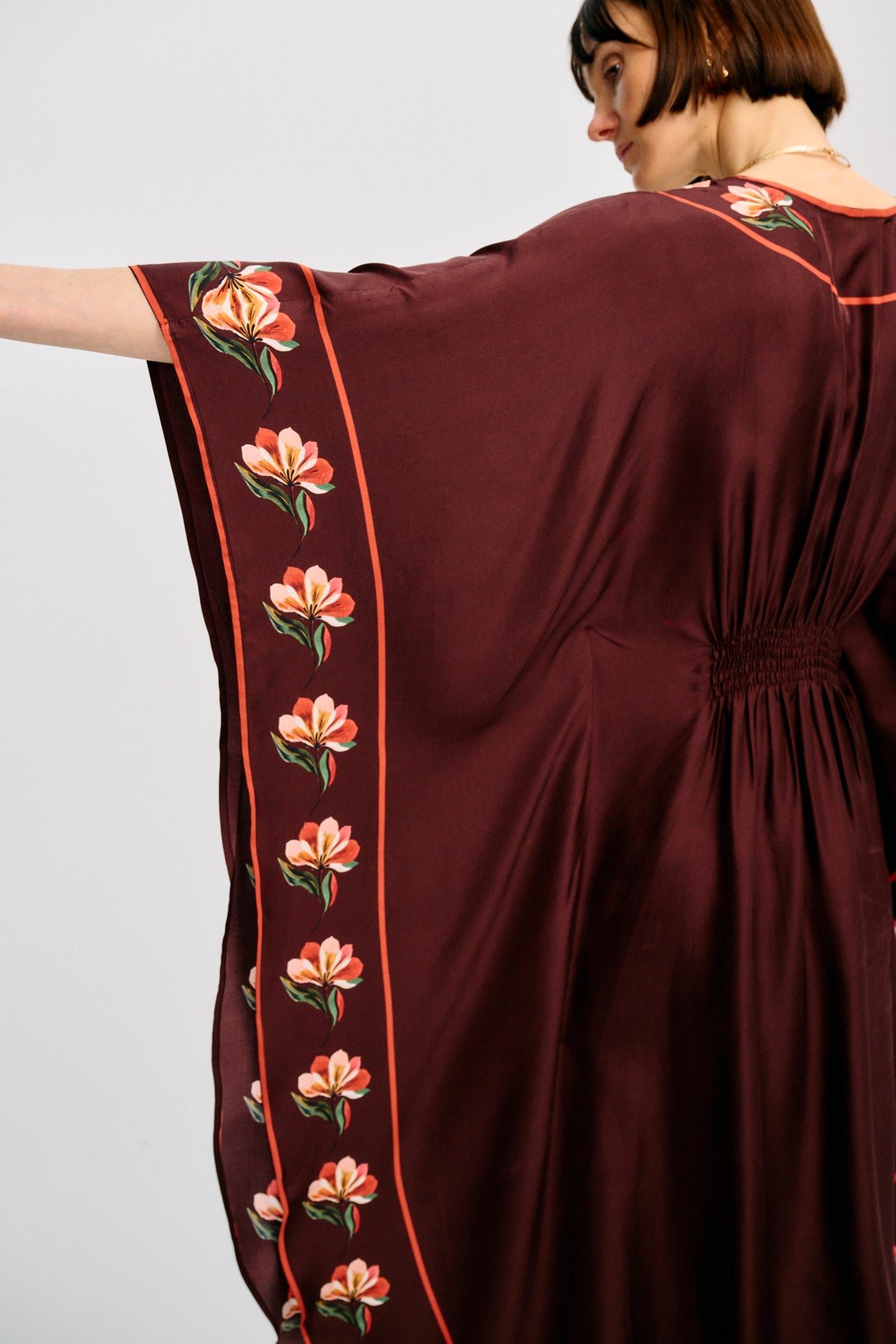 Carolina K Taiel Kaftan in vibrant fabric, flowing silhouette with intricate patterns, perfect for elegant, relaxed summer wear.