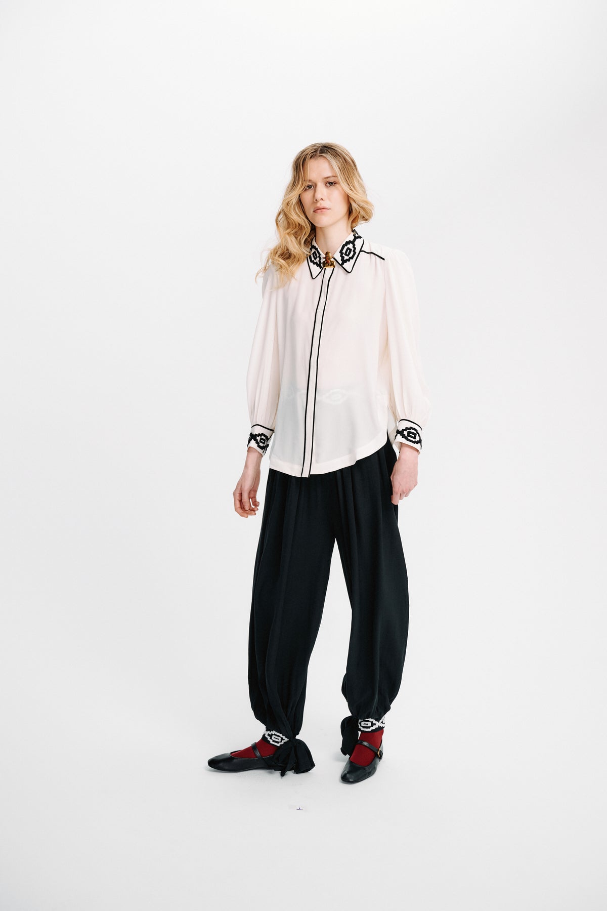 Light blue Kendall shirt by Carolina K, featuring a relaxed fit with button-down front and collar, displayed on a hanger.