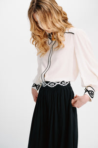 Carolina K Kendall shirt displayed on a model, featuring a stylish, casual design with patterned fabric and a relaxed fit.
