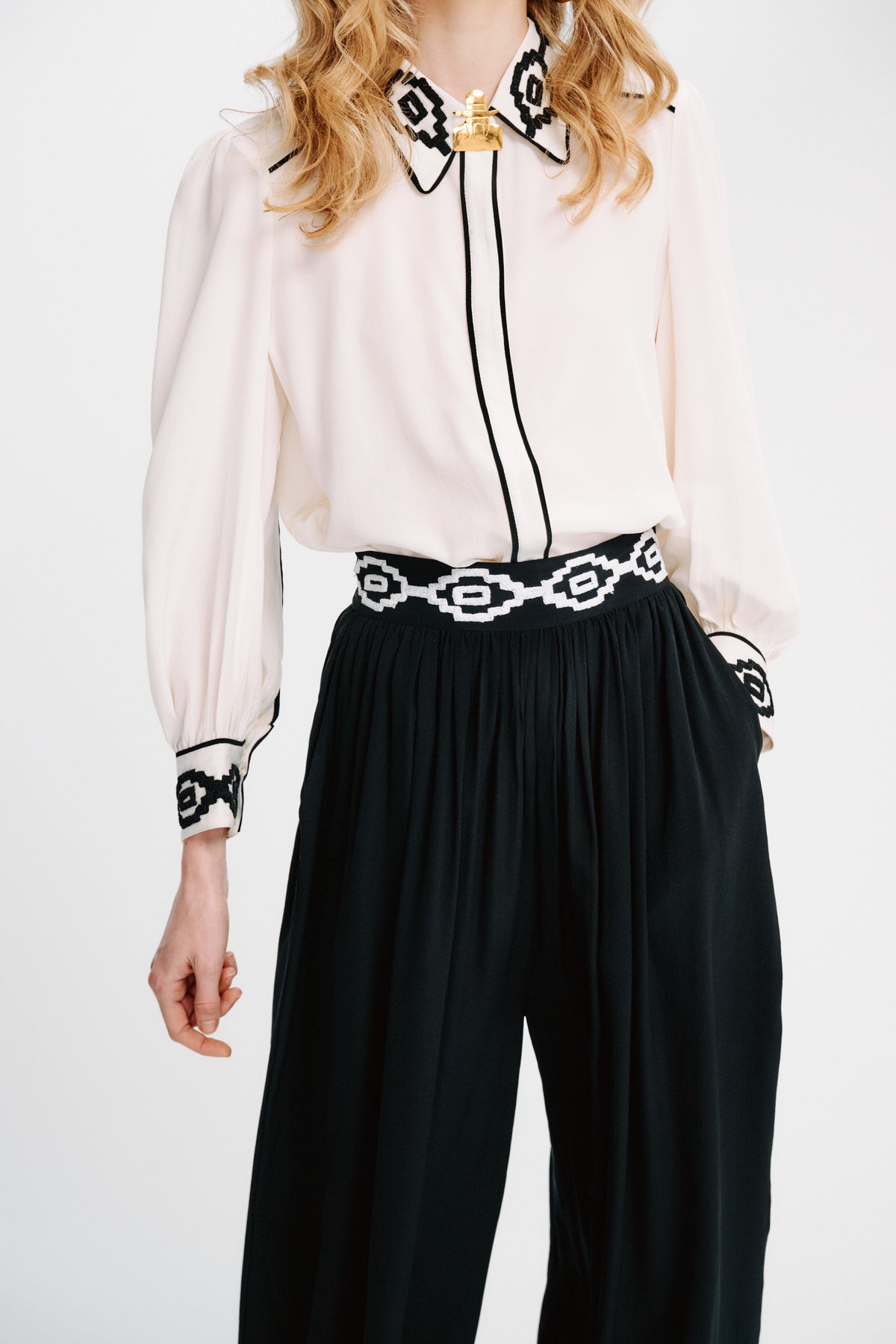 Carolina K Kendall shirt in a stylish design, featuring a comfortable fit and premium fabric, displayed on a hanger.