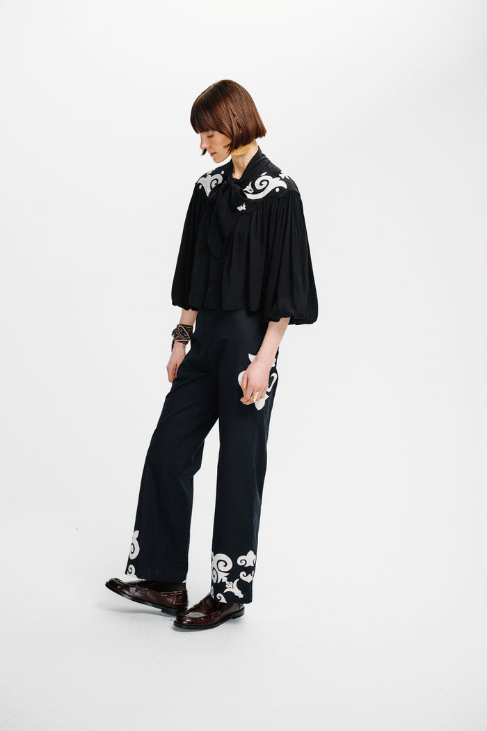 Carolina K Jena Top featuring a stylish, relaxed fit with vibrant patterns, perfect for casual and chic summer wear.