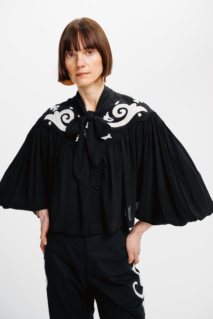 Carolina K Jena Top in stylish fabric, featuring a relaxed fit and vibrant pattern, perfect for casual or semi-formal wear.