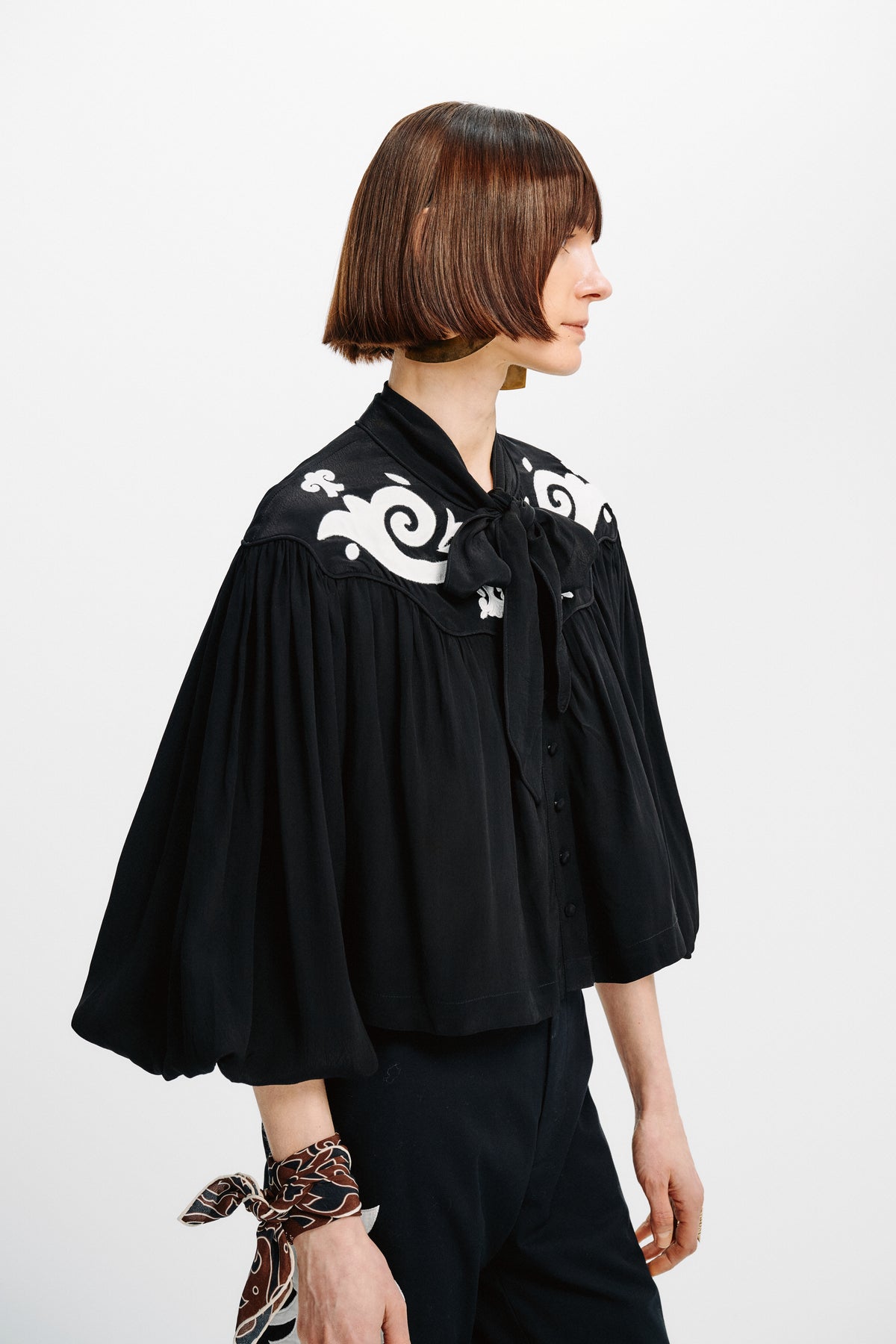 Carolina K Jena Top featuring a stylish design, displayed on a model, showcasing its fabric and fashionable fit.