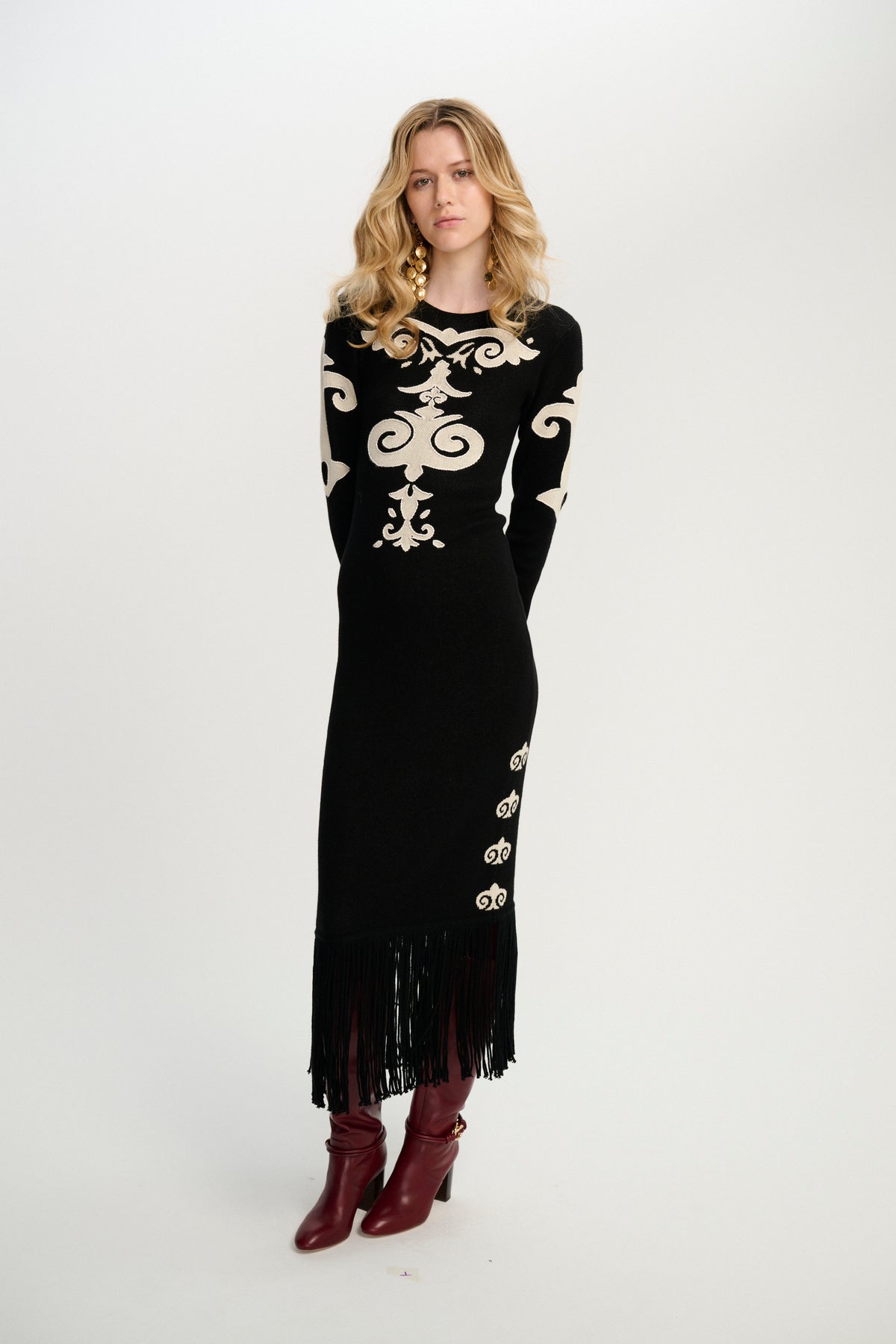 Carolina K Elizabeth dress featuring a vibrant, patterned fabric with a flowing silhouette and intricate design details.