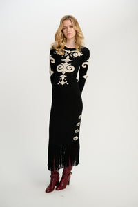 Carolina K Elizabeth dress featuring a vibrant, patterned fabric with a flowing silhouette and intricate design details.