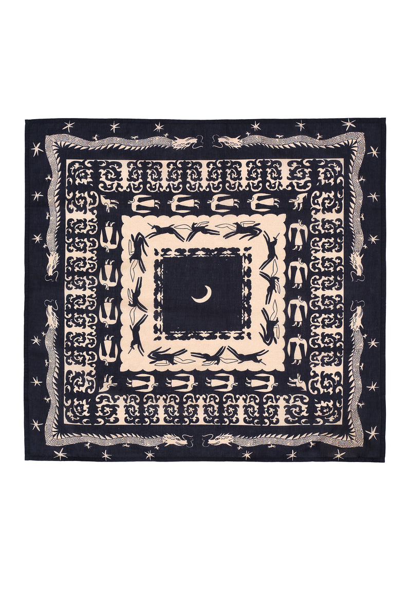 Square bandana in black and cream with an intricate folkloric design. The central motif features a crescent moon surrounded by symmetrical borders of galloping horses, mythical figures, stars, and dragons. The pattern builds outward in layers of storytelling-inspired symbols, creating a bold and graphic visual statement.