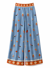 Carolina K stylish palazzo pants in flowing fabric with wide legs and vibrant pattern, perfect for casual or dressy occasions.