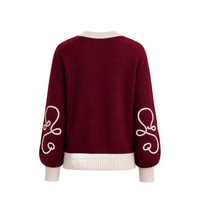 Back view of the Carolina K Elsa Cardigan, showcasing its knit texture and relaxed fit in a soft, stylish design.