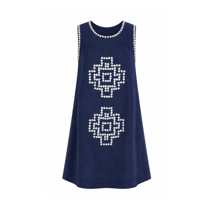 Sleeveless navy linen shift dress with a relaxed A-line silhouette. Features hand-applied white sequin geometric motifs on the front, white sequin trim along the neckline and armholes, subtle shoulder pleats, and a concealed back zipper.