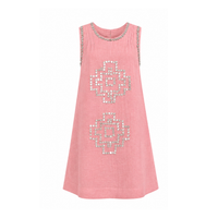 Sleeveless pink linen shift dress with a relaxed A-line silhouette. Features hand-applied silver sequin geometric motifs on the front, sequin trim along the neckline and armholes, subtle pleating at the shoulders, and a concealed back zipper.
