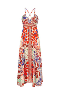 A vibrant maxi dress featuring our signature Punta print. Designed with a flattering empire waist, beaded halter straps, and a flowing silhouette, it combines effortless elegance with a bold artistic pattern inspired by the coast.