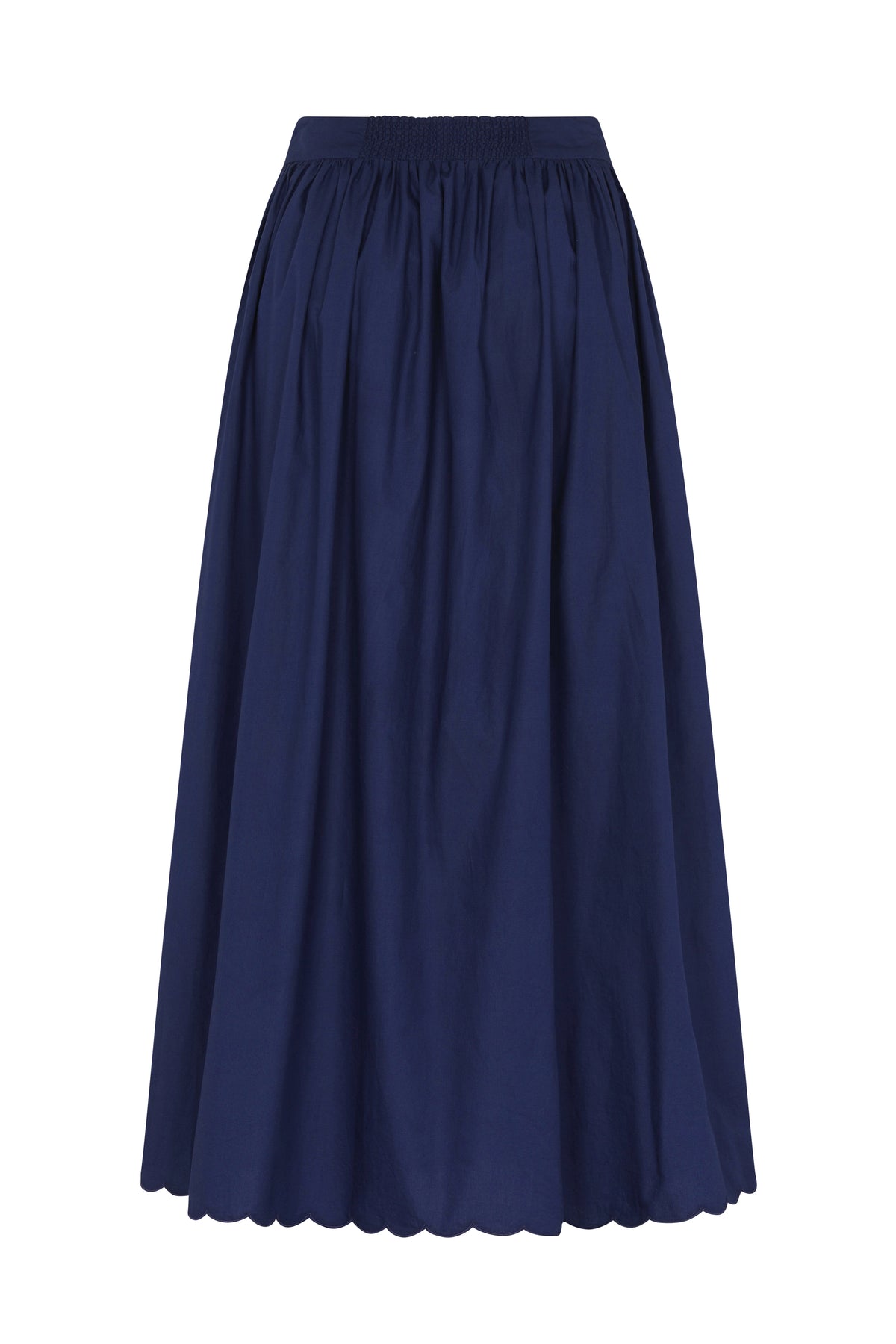 Back view of a navy blue midi skirt with a smocked elastic waistband, full gathered silhouette, and scalloped hem.