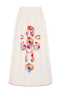 Flowy midi skirt in off-white cotton featuring a colorful placement print inspired by coastal motifs. Designed with a fitted waistband and finished with a scalloped hem trimmed in contrast red embroidery.