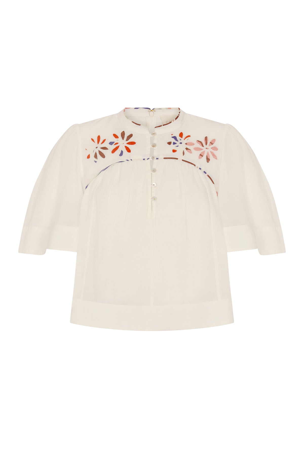 Lightweight off-white blouse featuring colorful floral cutout embroidery across the yoke and delicate contrast piping detail. Designed with a band collar, partial button placket, softly gathered silhouette, and relaxed elbow-length sleeves.