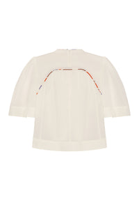 Off-white blouse with a fluid, relaxed fit and gently gathered back panel. Finished with contrast printed piping detail across the upper back and voluminous elbow-length sleeves for an airy, feminine look.