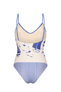 One-piece swimsuit with a low scoop back, adjustable straps, and contrast whipstitch edging. The sailboat print continues across the back, complemented by striped panel details that enhance the streamlined silhouette.