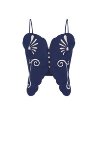 Front view of a navy blue cropped top with thin straps, scalloped edges, front button detail, and white embroidered floral and scroll motifs.