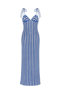 Hand-crocheted maxi dress featuring a striking blue and ivory striped pattern from bodice to hem. Designed with floral crochet cups, a sweetheart neckline, and adjustable braided tie straps, creating a fitted silhouette with a handcrafted, resort-inspired aesthetic.